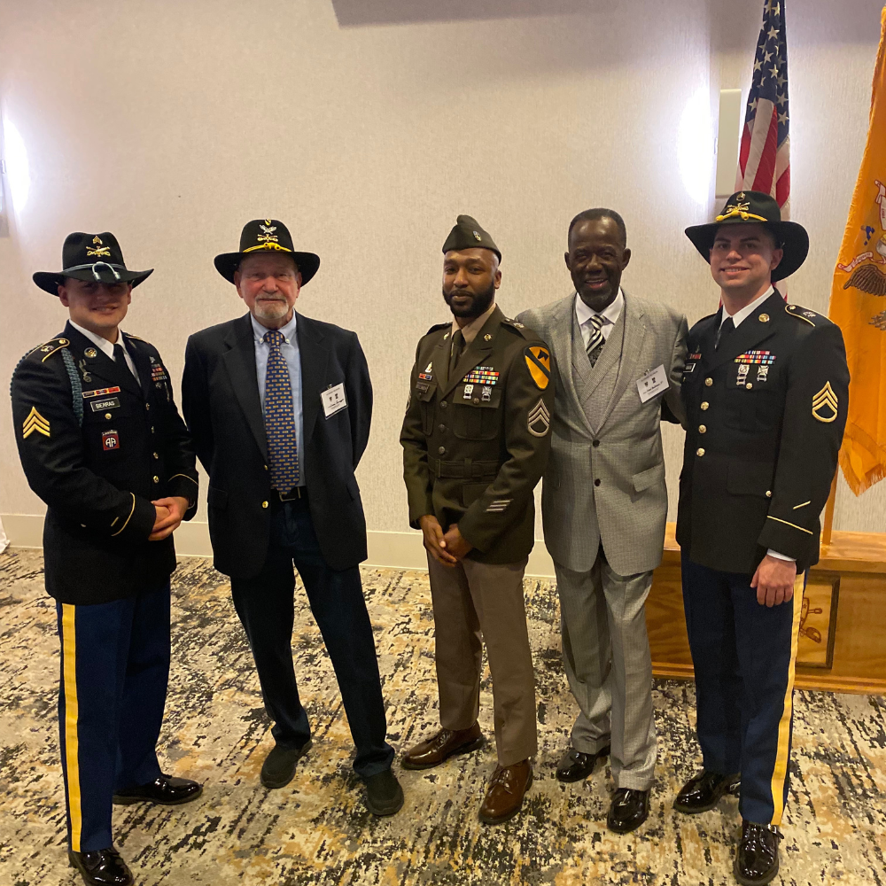 Lovell Henderson with veterans at an event.